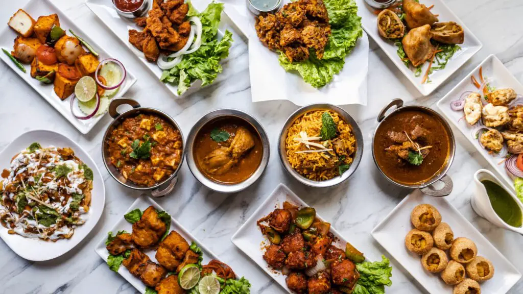 Indian food placed on marble table